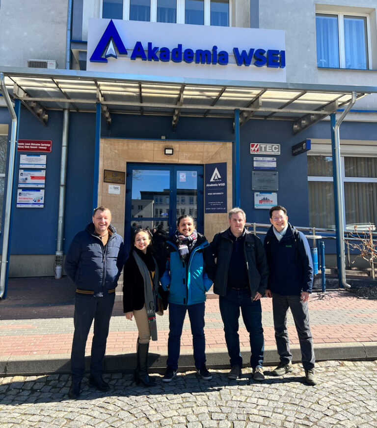 Posing outside the university